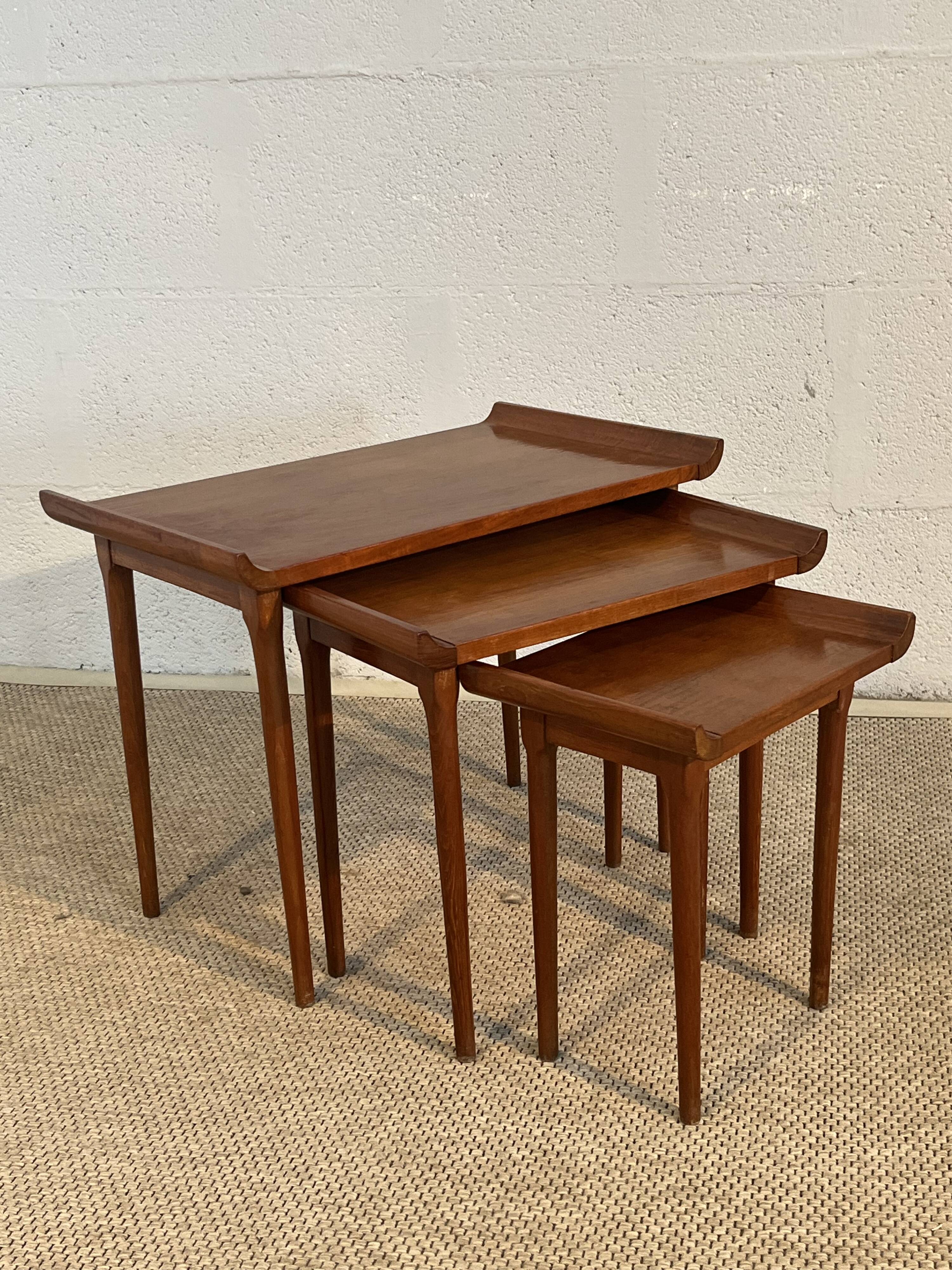 Set of three nesting low tables in a Japanese style, made of mahogany.