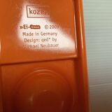 Pair of orange koziol egg cups Michael Neubauer