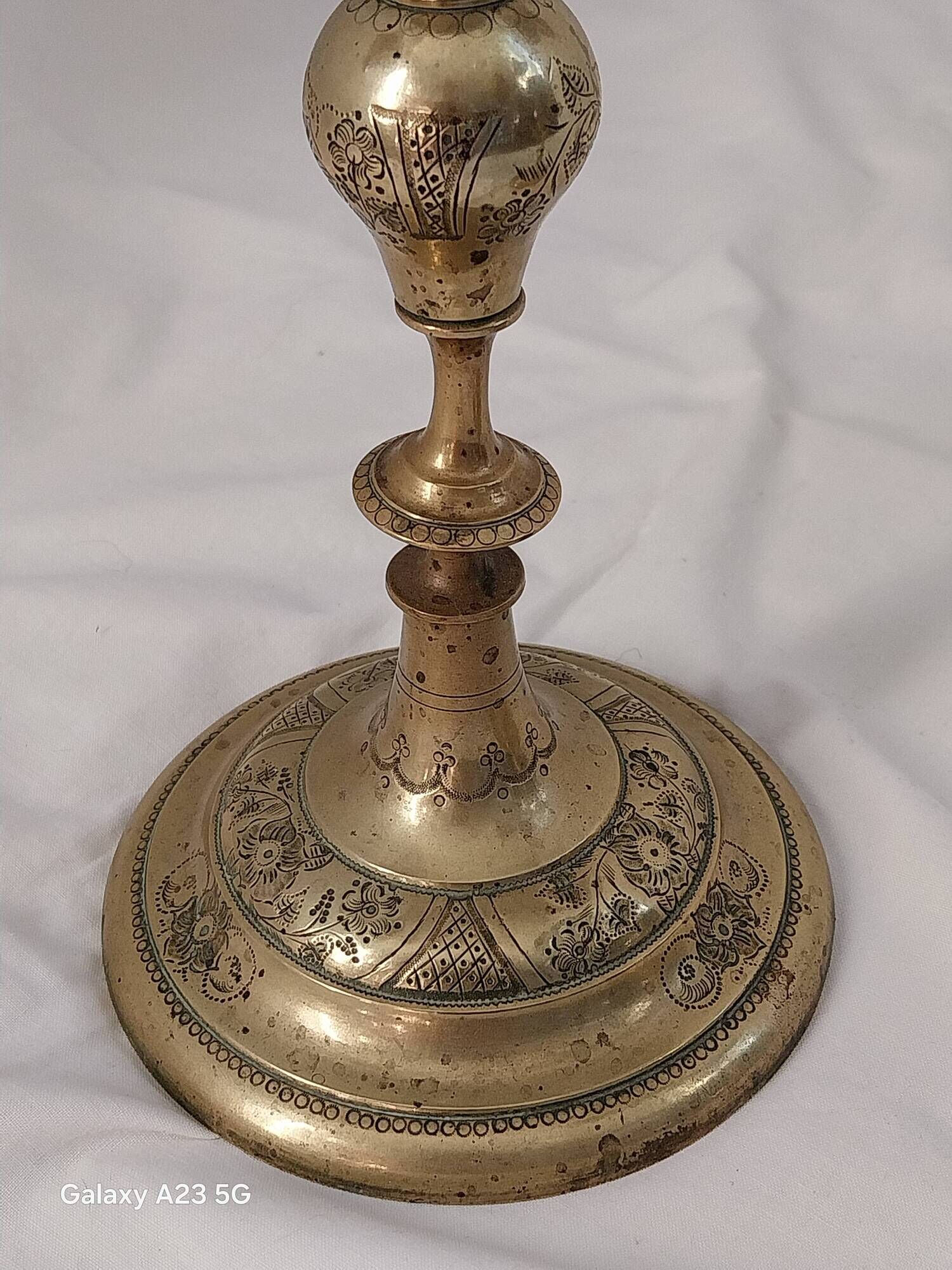 Pair of chiselled brass candelabra. Swedish craftsmanship, 20th century.