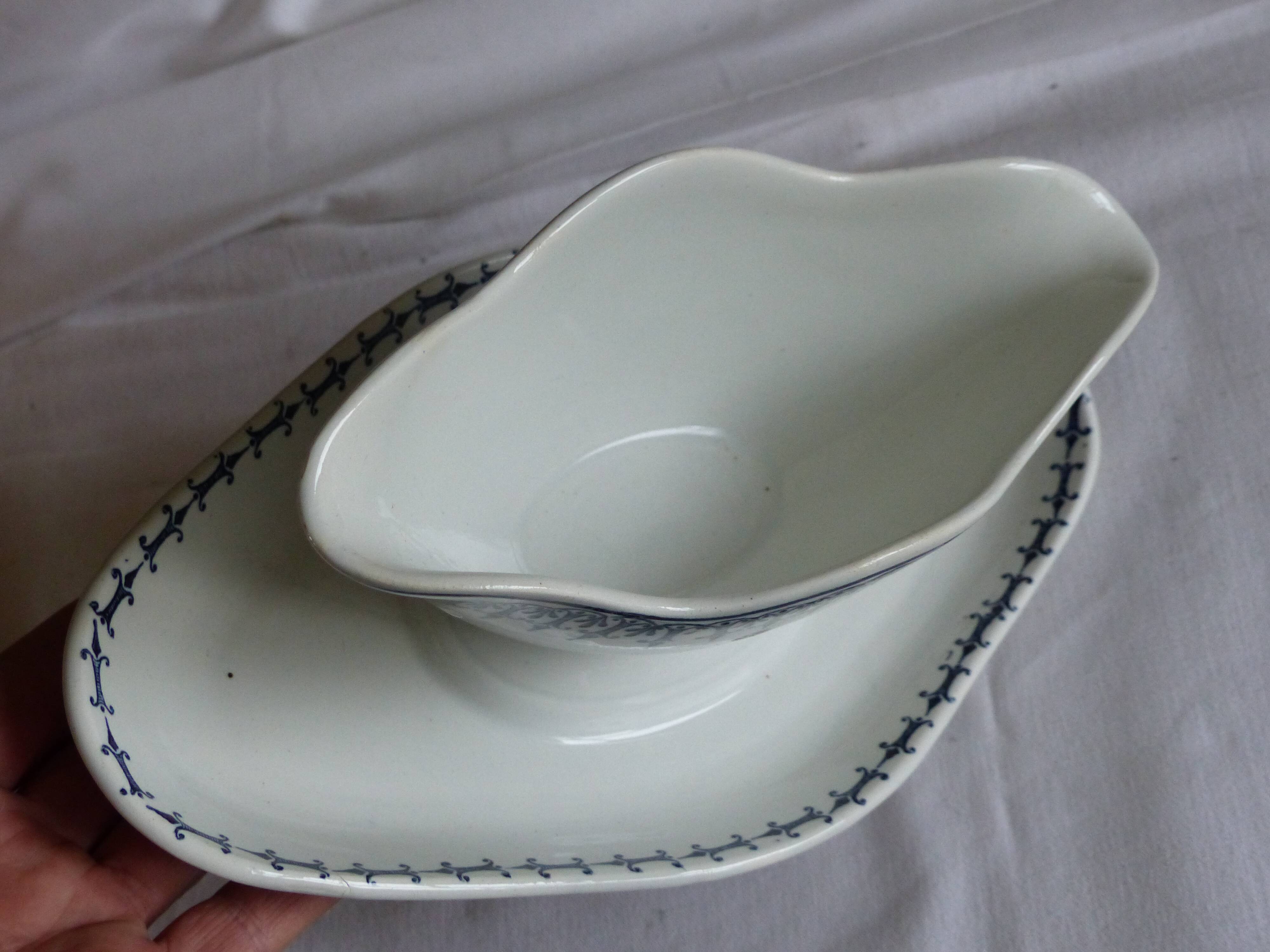 Earthenware gravy boat from Saint Amand.