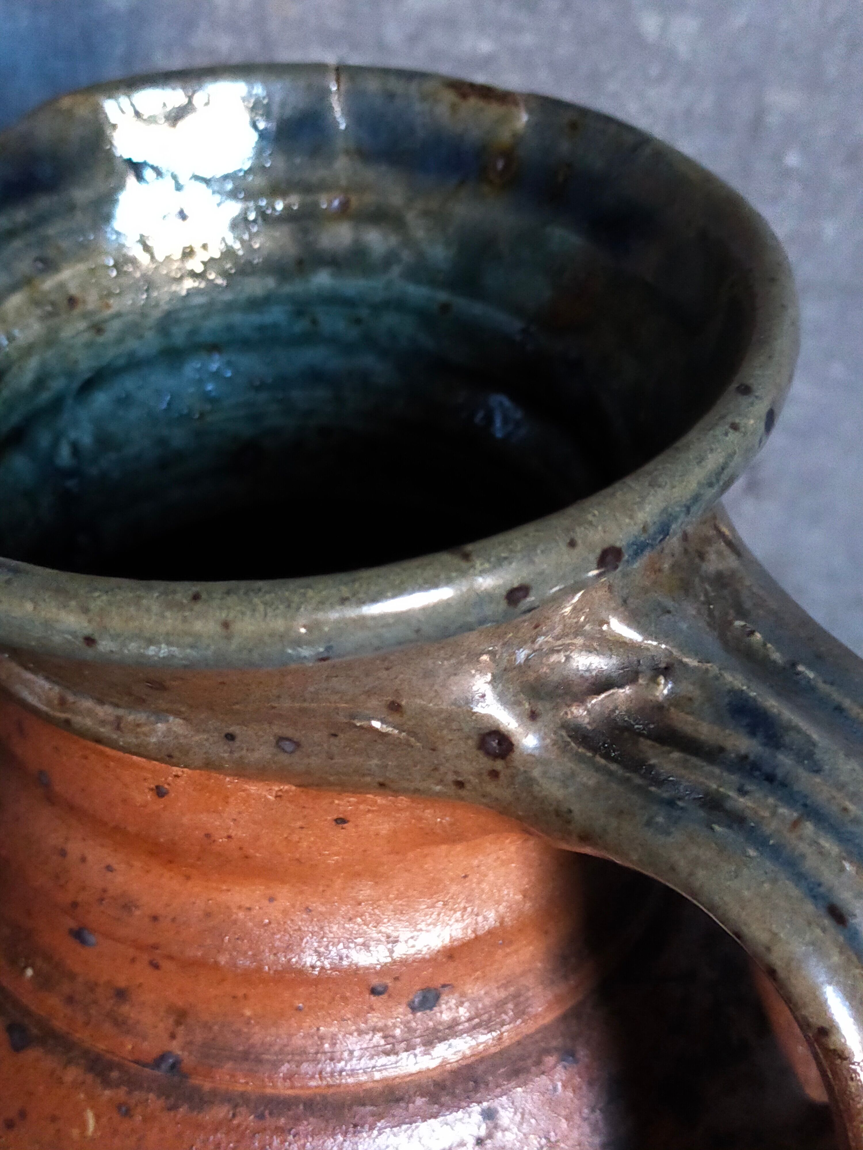 Pitcher traditional pottery Folk art in old enamelled sandstone