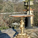 Carved and lacquered wooden side table.