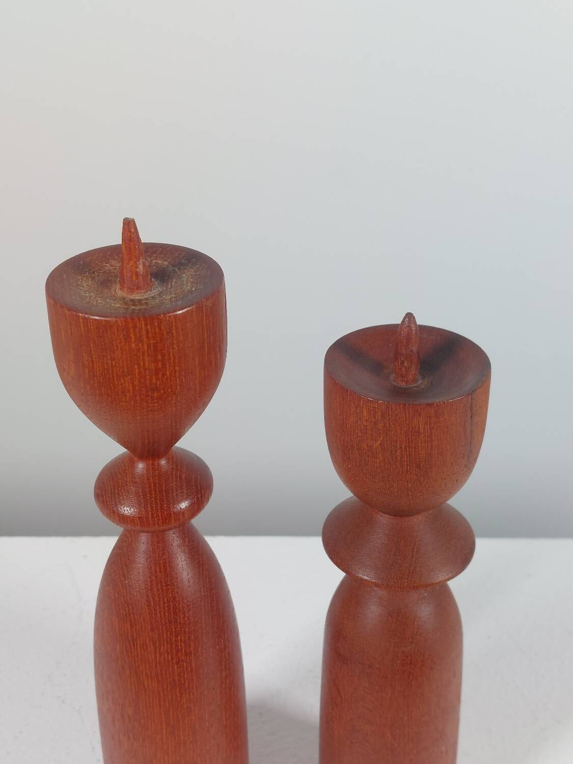 Vintage pair of sculptural teak candlesticks in Scandinavian style.