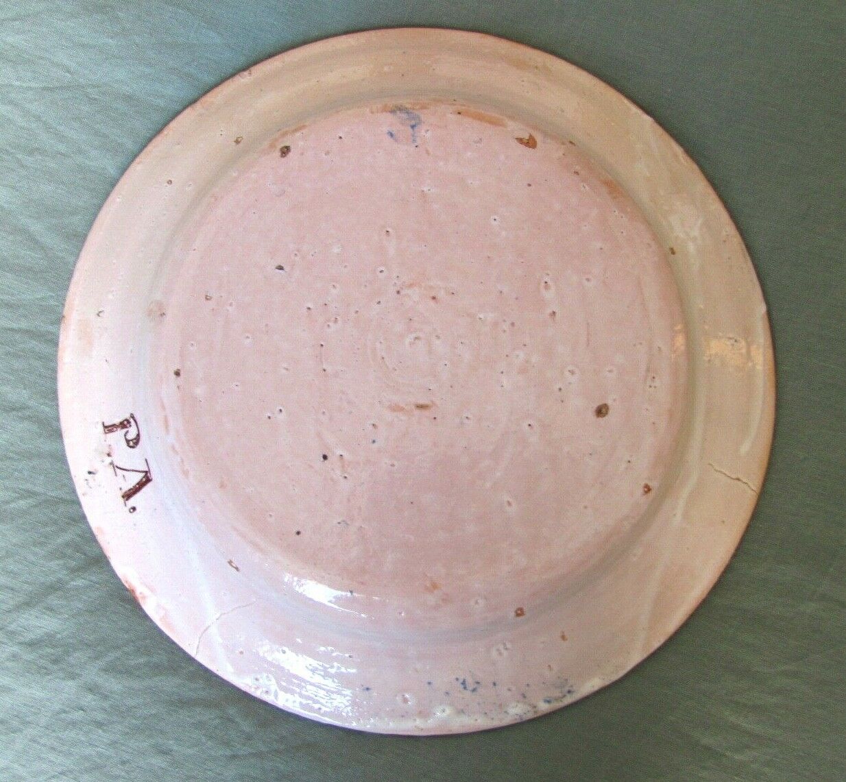 Faience dish decorated with yellow bird on a blue background