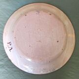 Faience dish decorated with yellow bird on a blue background