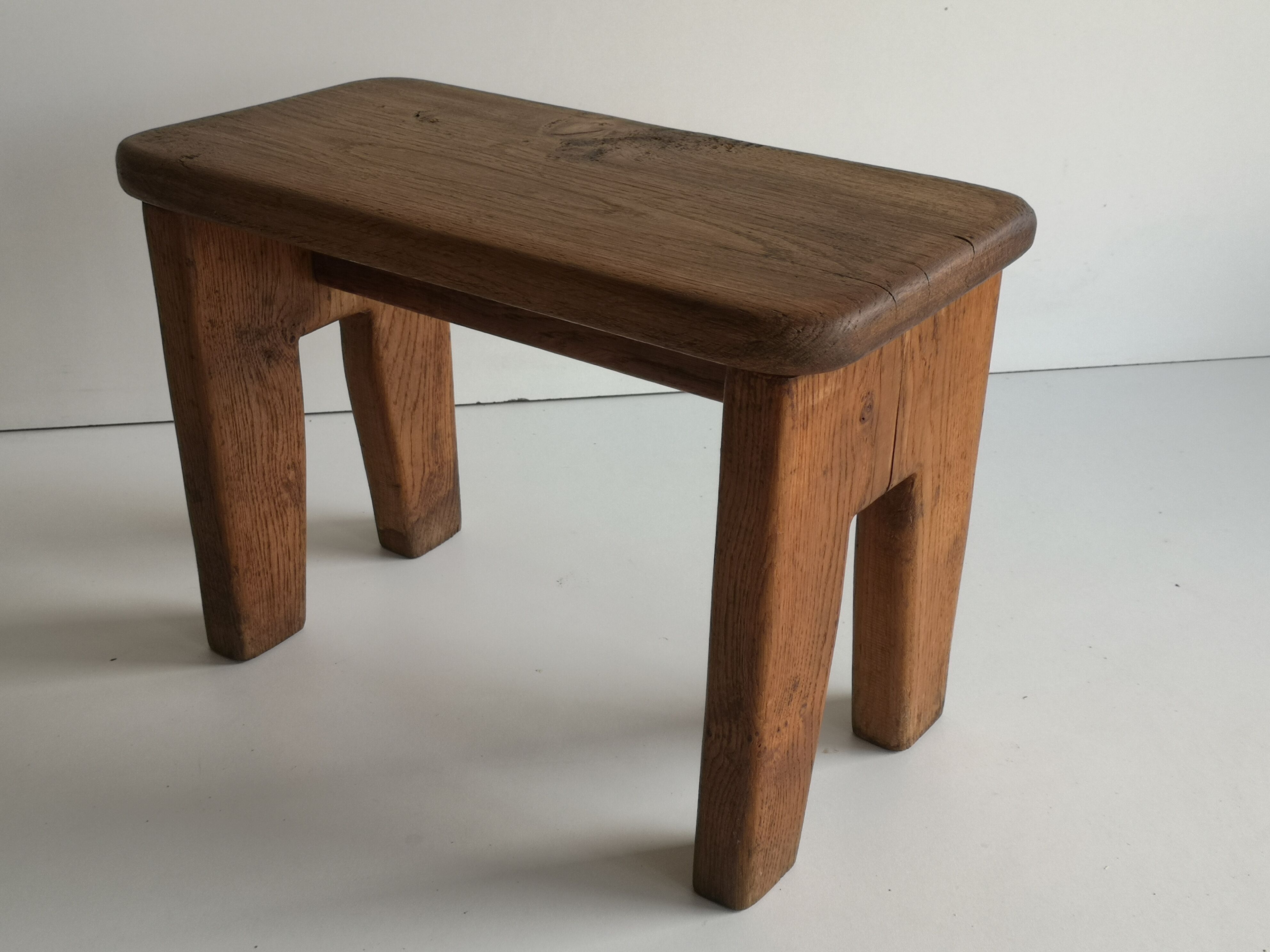 Small low stool in solid oak