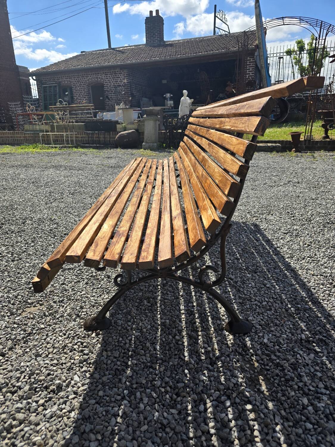 Wooden garden bench with cast iron base