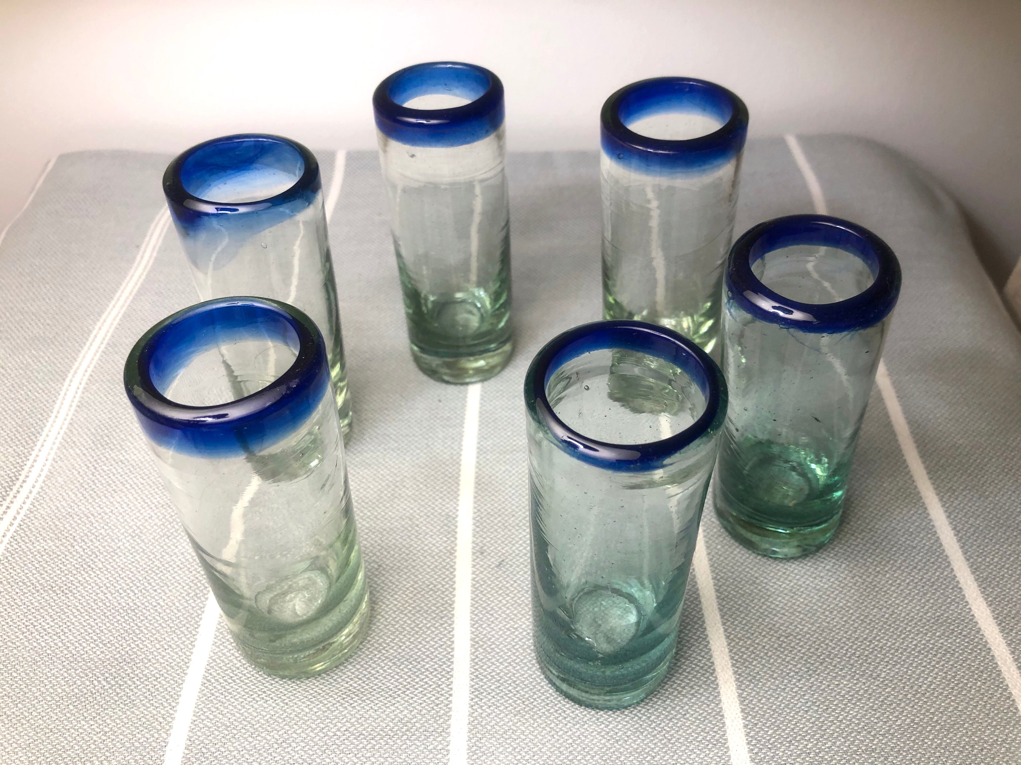 Handmade cobalt blue tequila glasses made of recycled glass