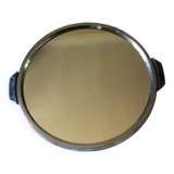 A large round mirror tray with metal handles