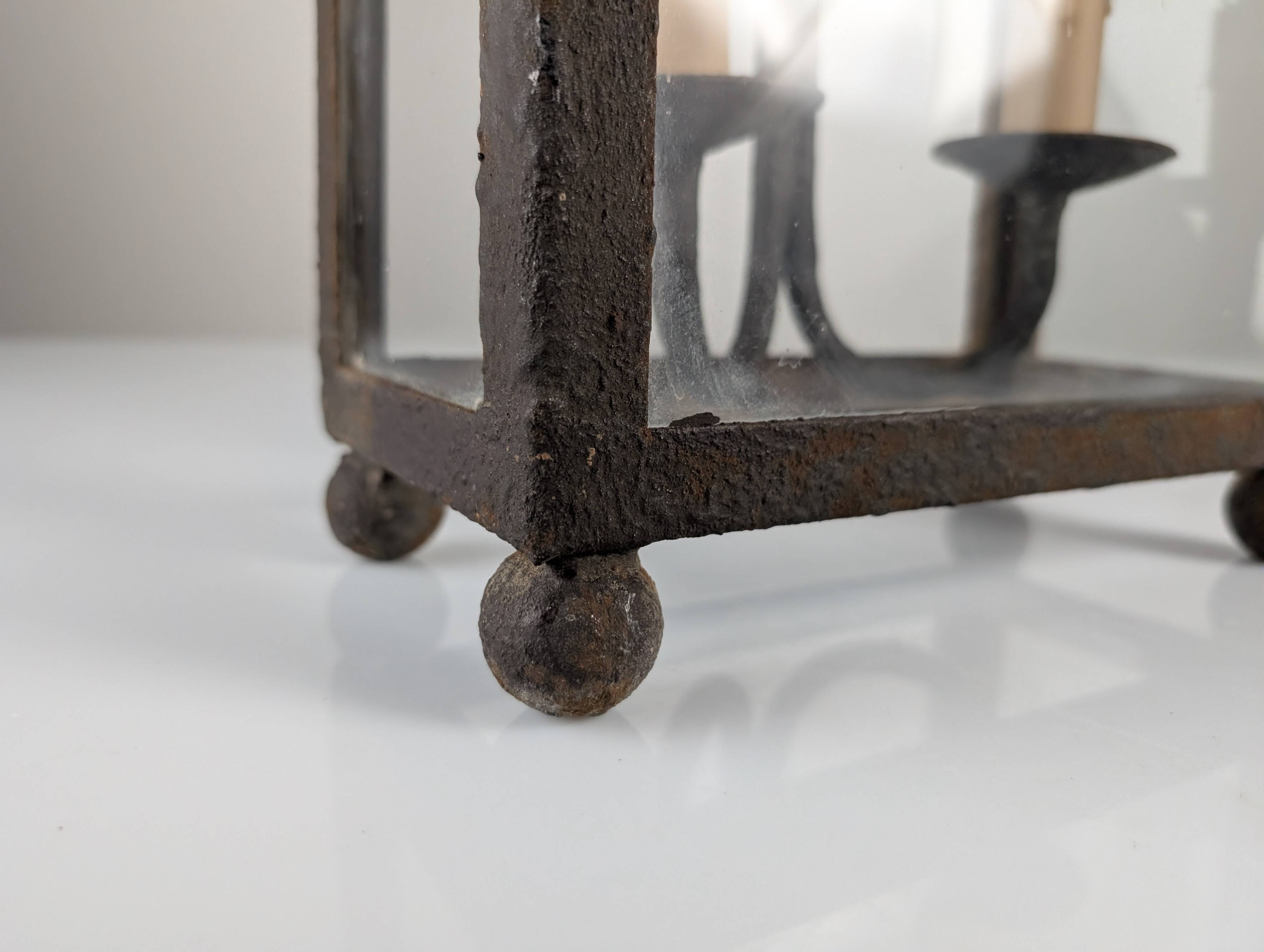 Wrought iron lantern with glass panels, leaf motifs