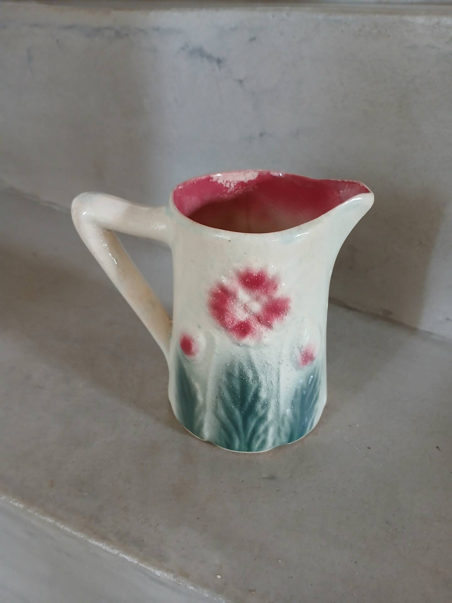 Small antique jug in slipware.