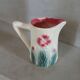 Small antique jug in slipware.