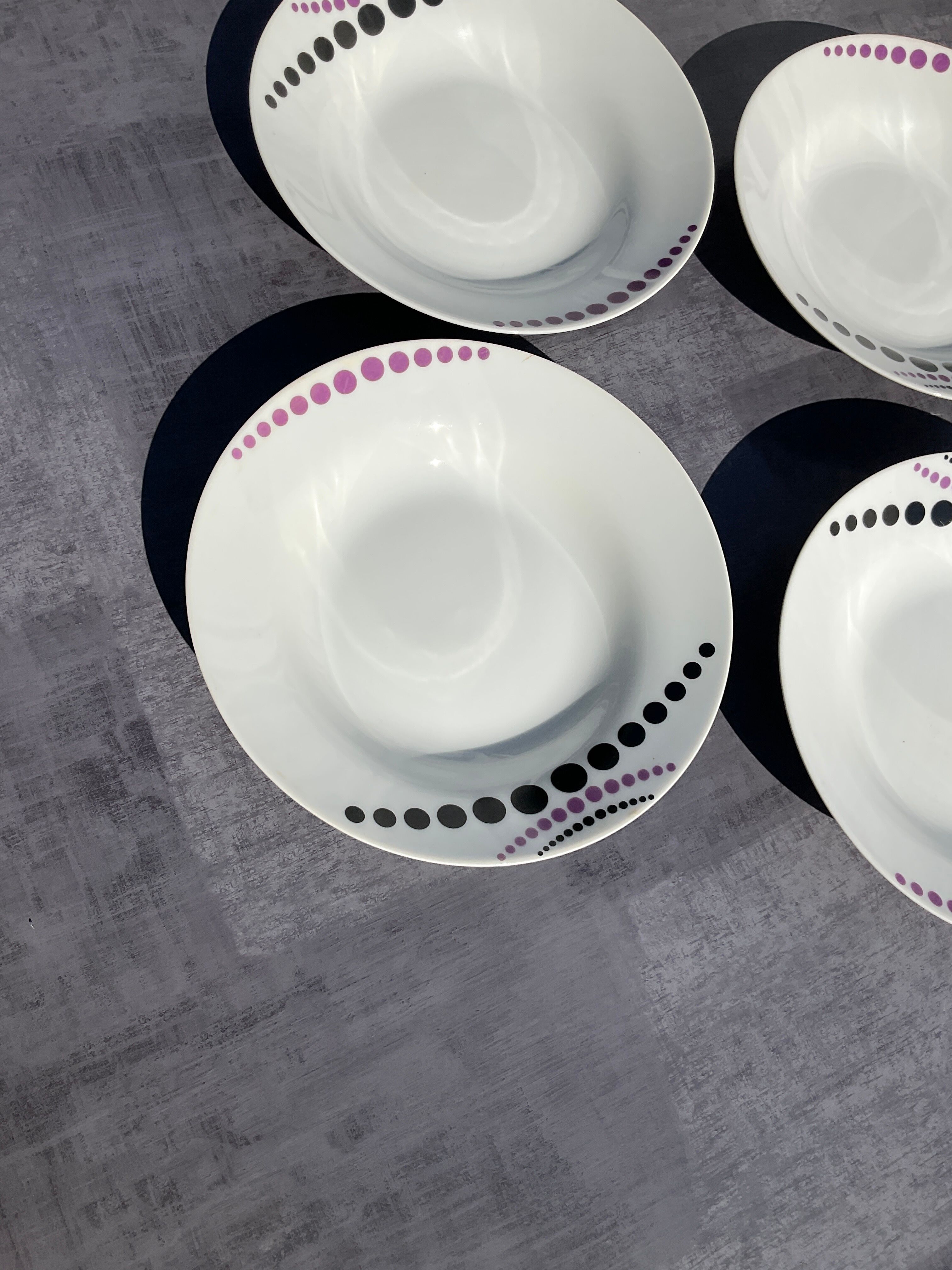Vintage white hollow plates with purple polka dots