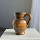 Speckled stoneware jug with grape pattern H17