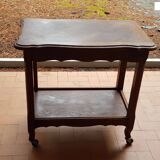 Wooden side table on casters