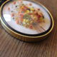 Vintage medallion domed glass dried flowers black gold