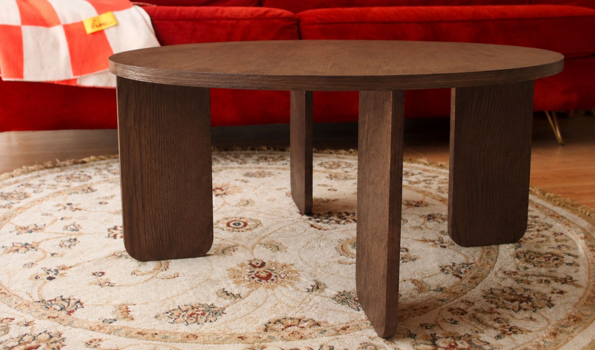 Round table in dark oak veneer
