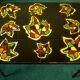 Signed black steel-ceramic side table
