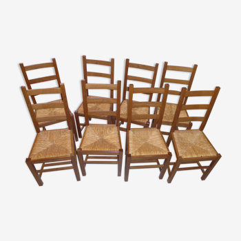 8 wooden chairs, straw seat