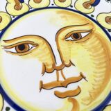 Decorative ceramic plate with sun face