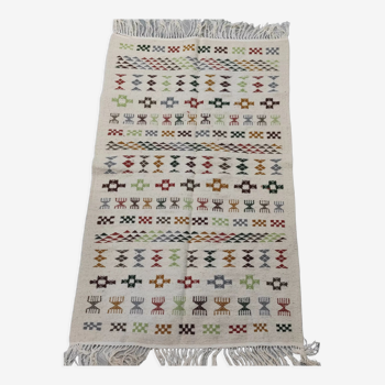 White carpet with multicolored Berber patterns handmade