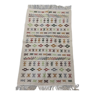 White carpet with multicolored Berber patterns handmade