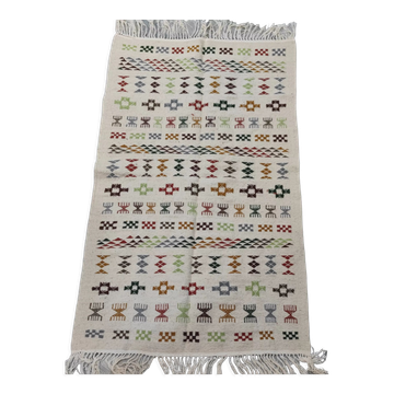 White carpet with multicolored Berber patterns handmade
