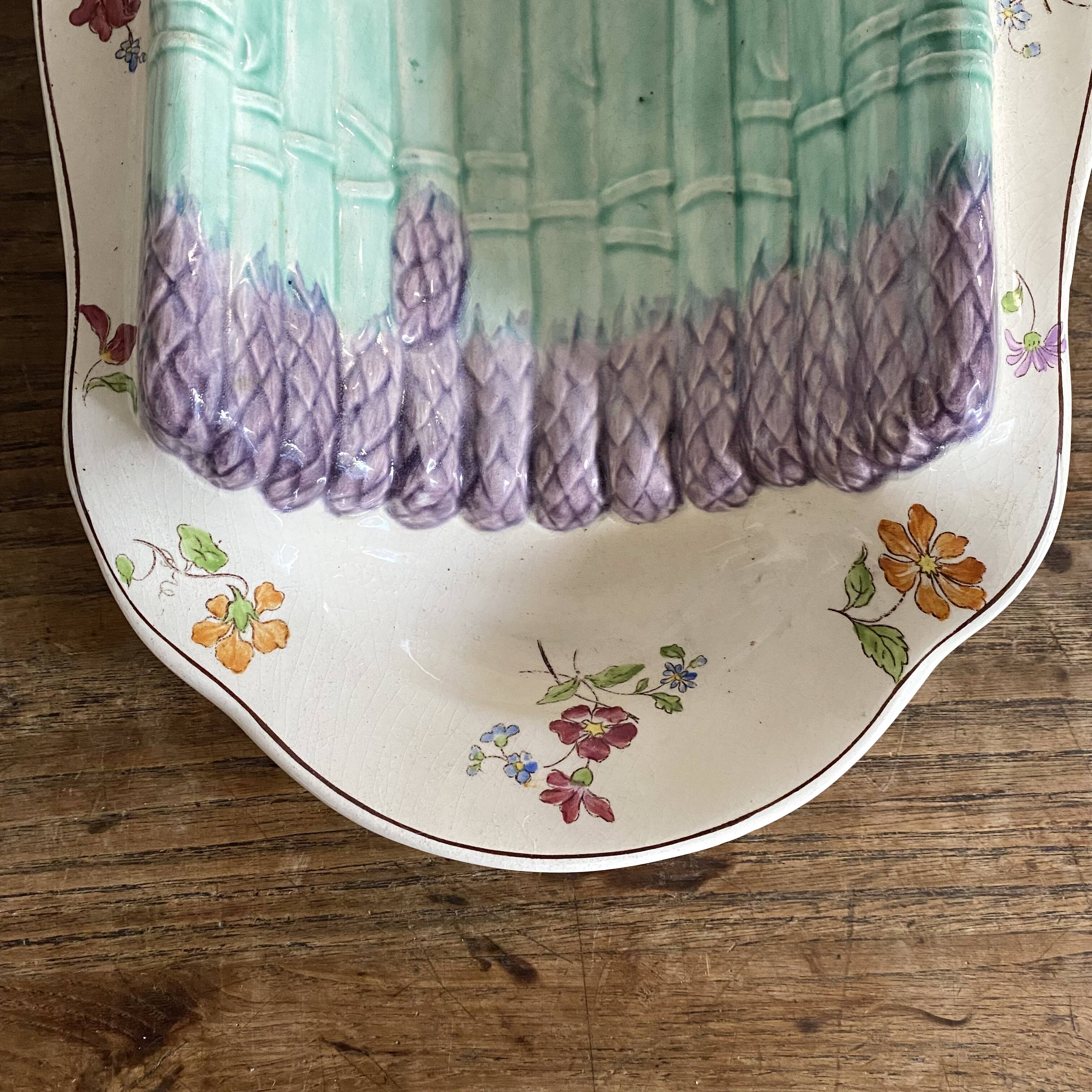 Longchamp asparagus dish in ironstone and slipware, 1900