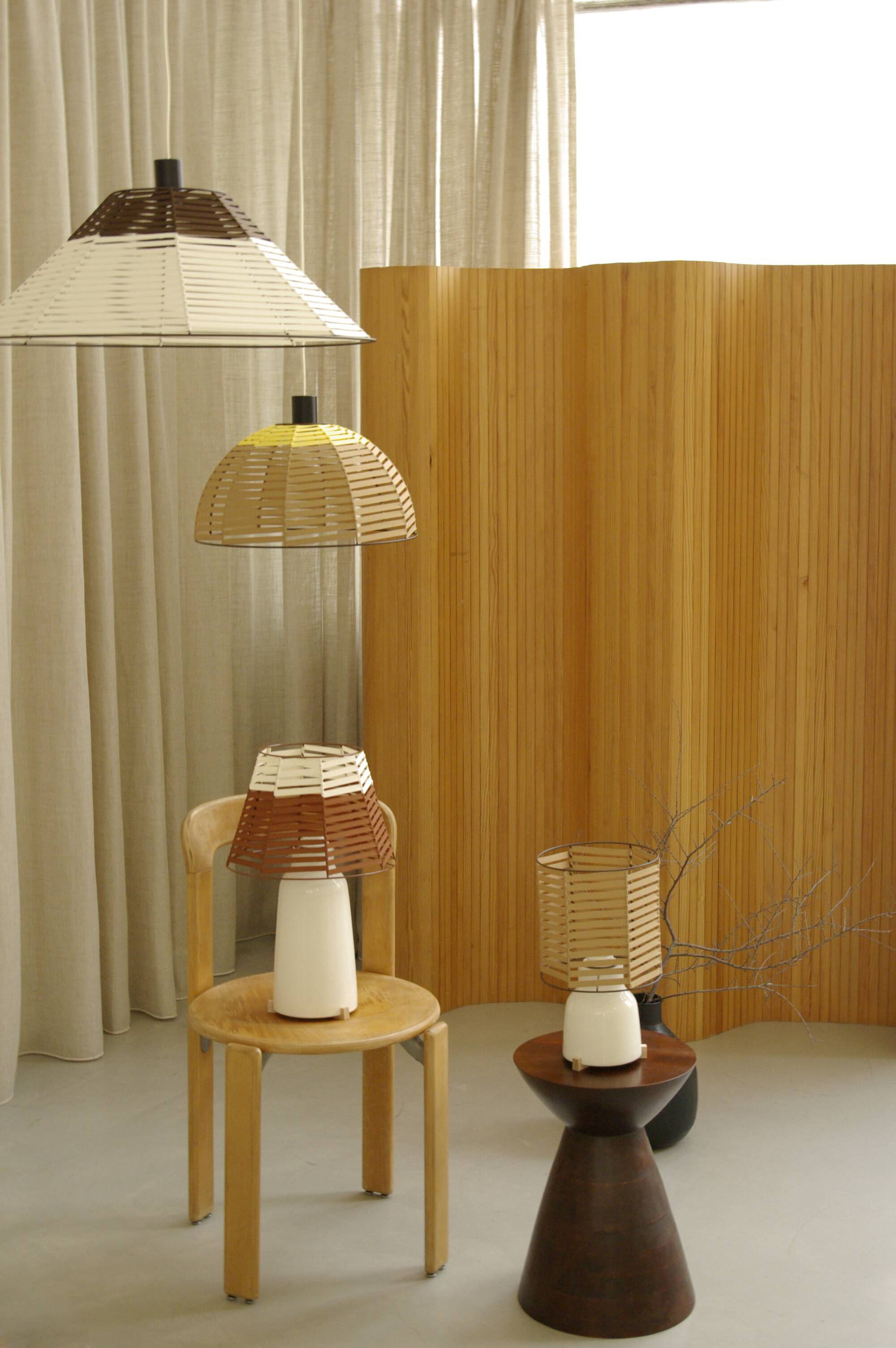 Woven bell suspension on metal structure.