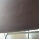 Brown leather chairs and Zanotta metal legs