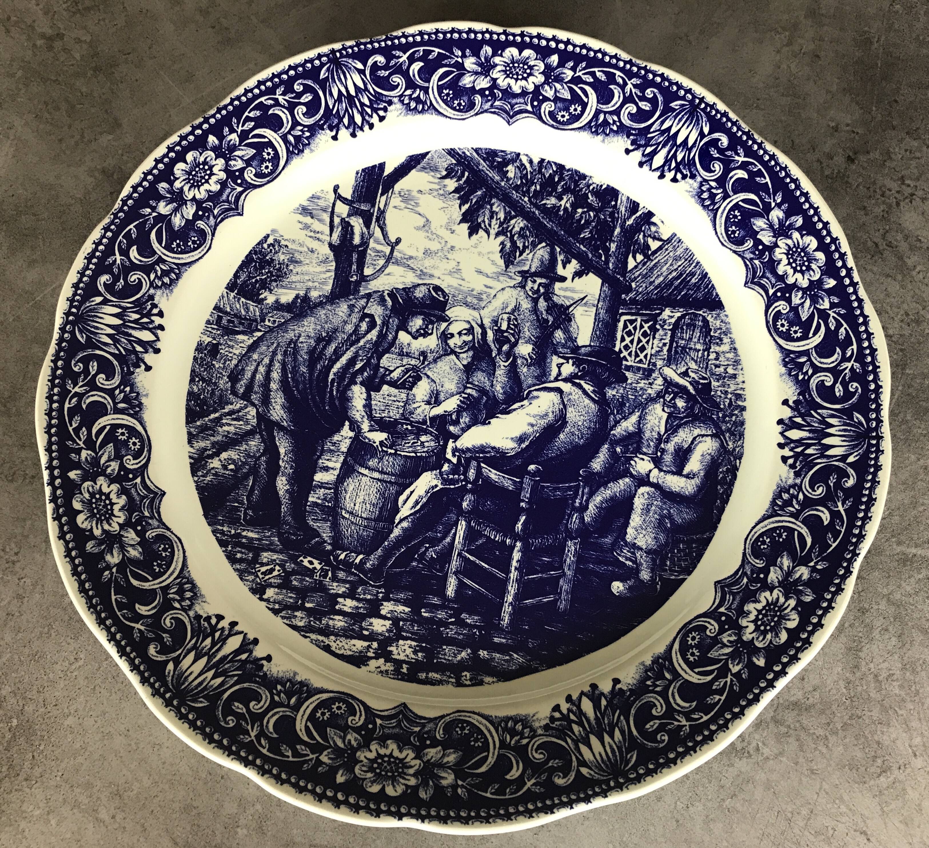 Blue enamelled earthenware wall dish with peasant scene decor Boch La Louvière