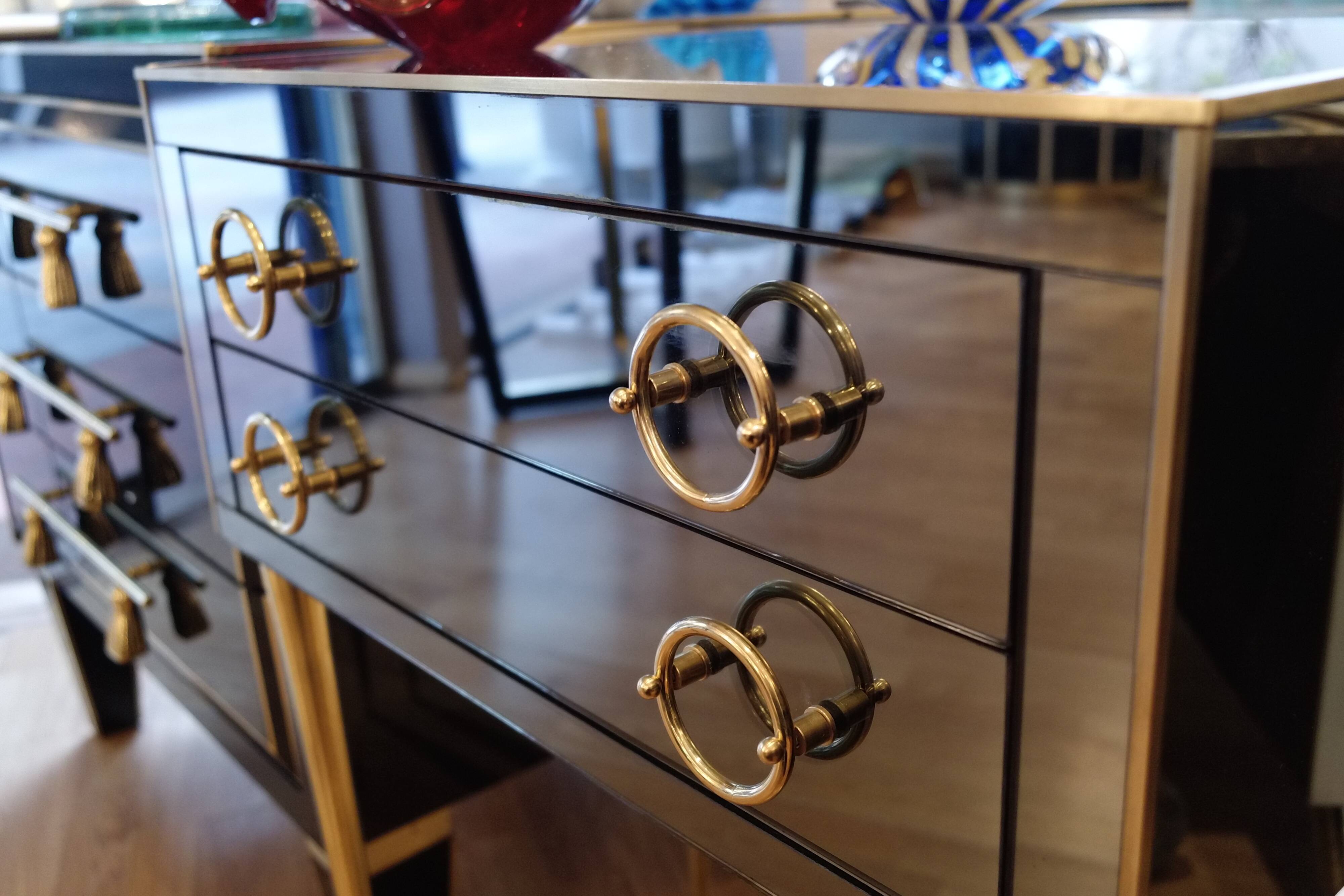 Pair of nightstands in anthracite colored glass and brass