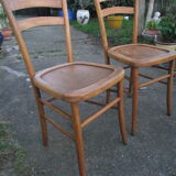 A pair of Lutherma bistro chairs
