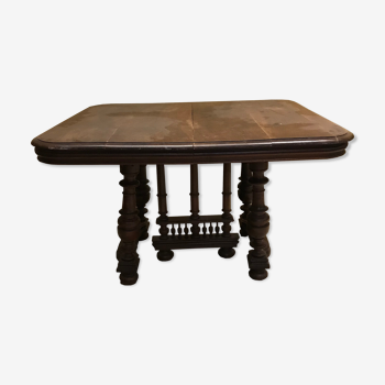 Table with carved wooden foot