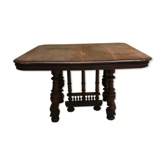 Table with carved wooden foot