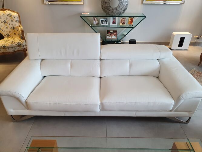 2 white leather sofas