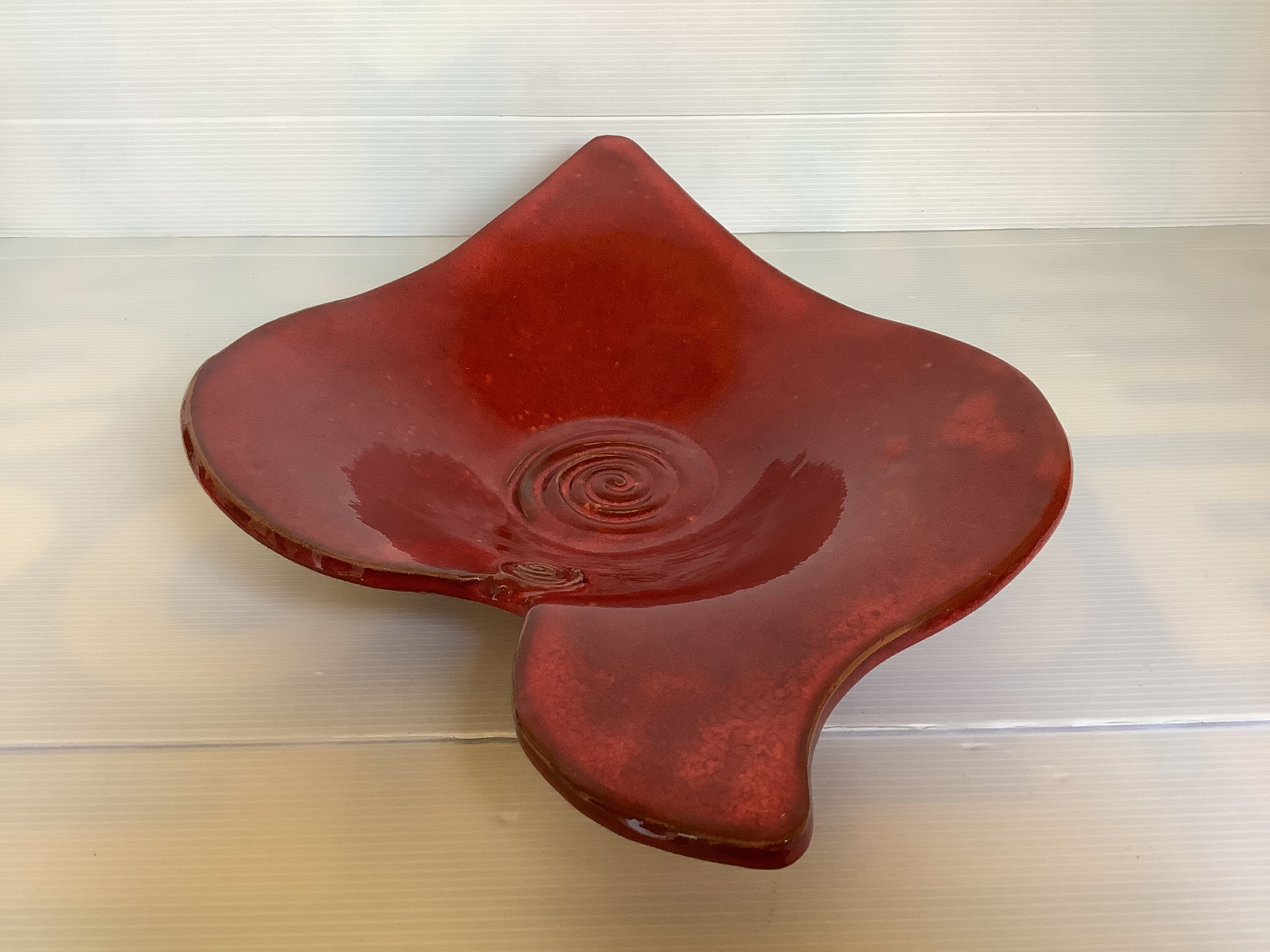 Red terracotta spiral pattern fruit bowl