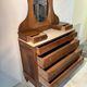 Antique carved wooden dressing table with marble and tilting oval mirror.