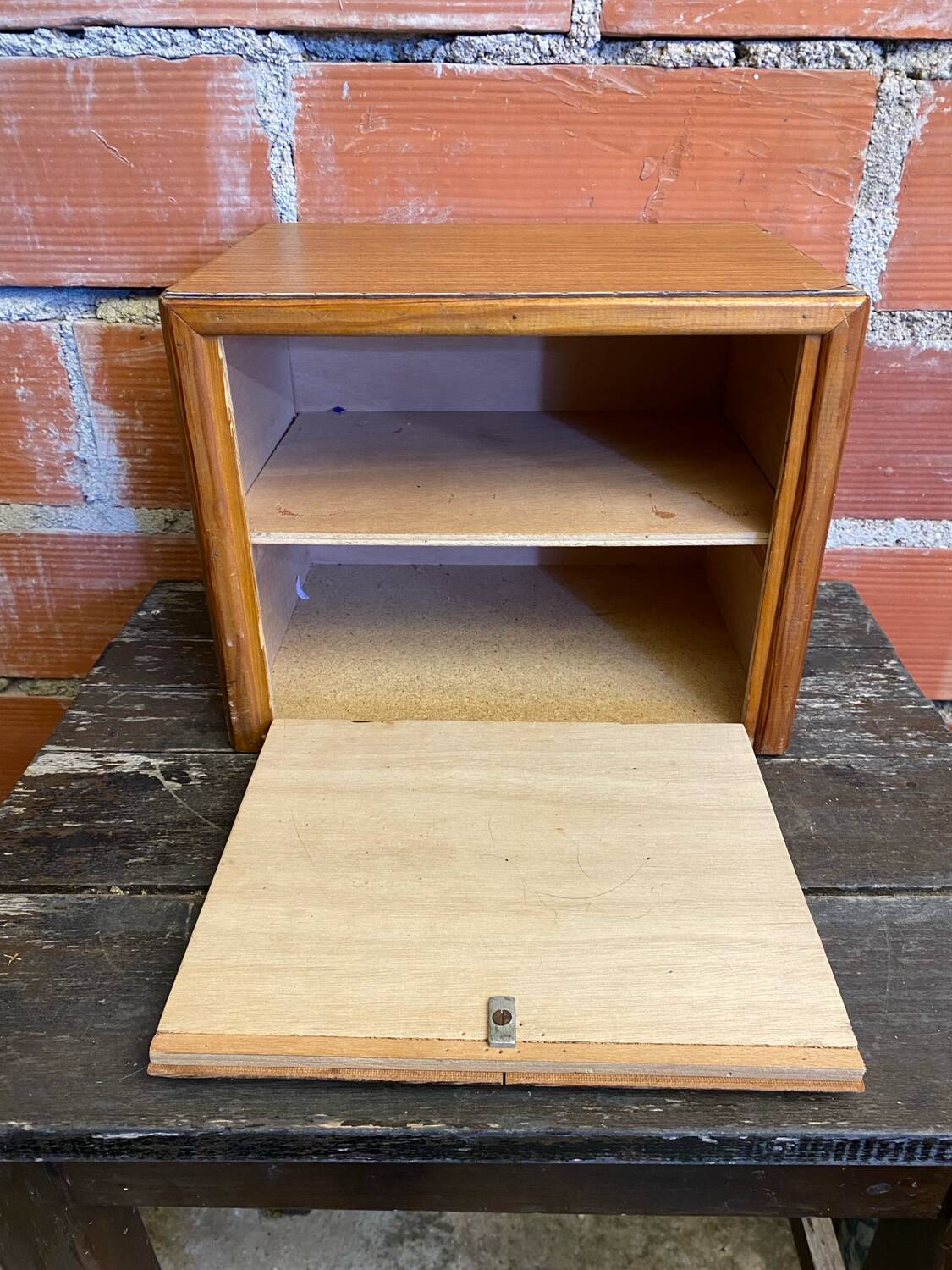 Vintage wooden storage cabinet with shelves