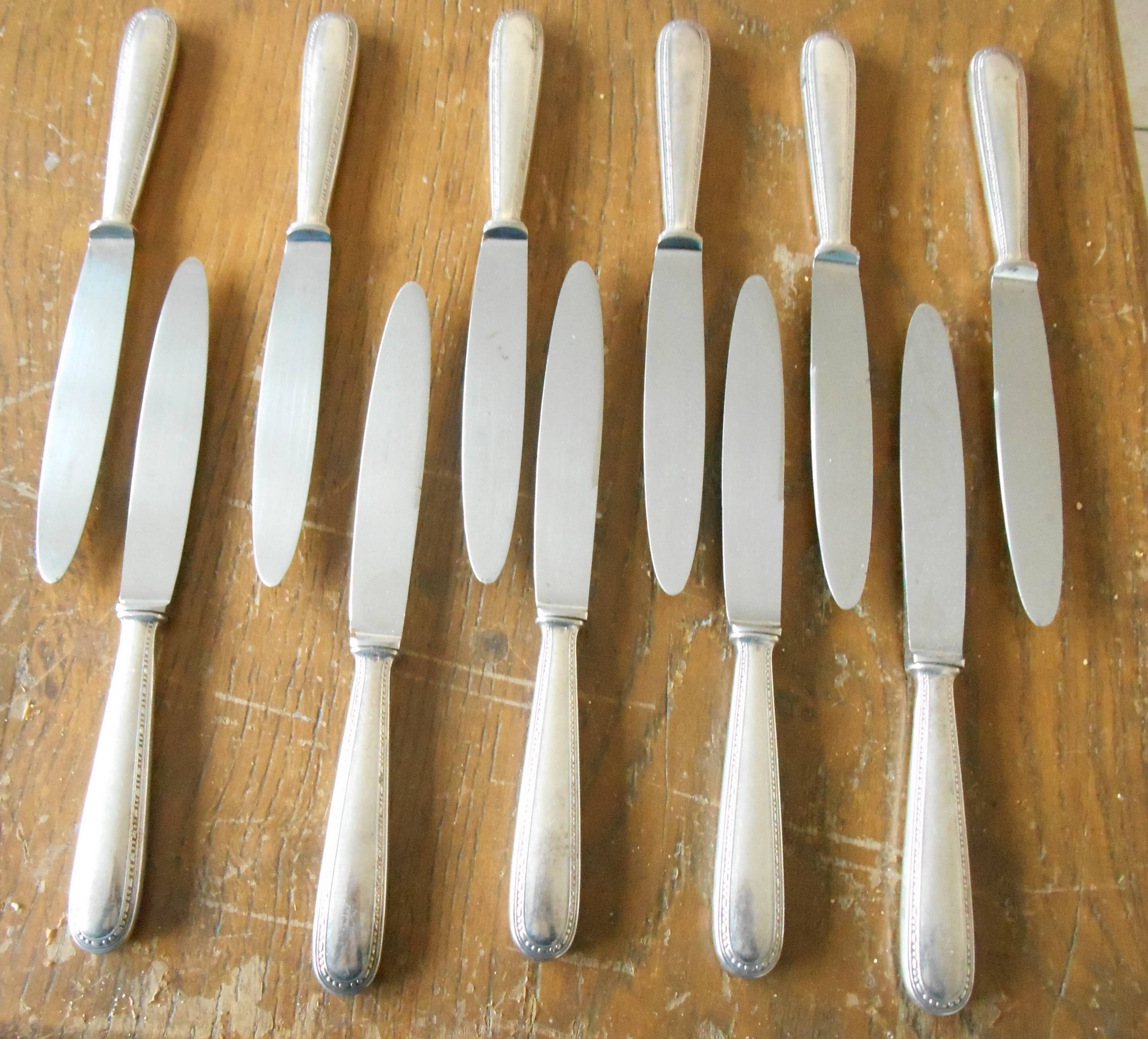 11 silver metal knives
