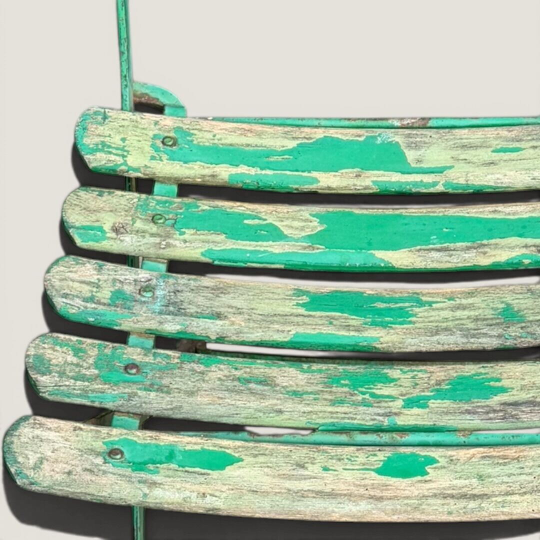 Bistro tables and folding chairs with a patina from the original 1930s.