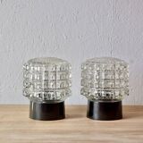 Old pair of molded glass and Bakelite wall or ceiling lights