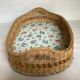 Old wicker basket tray with wooden beads.