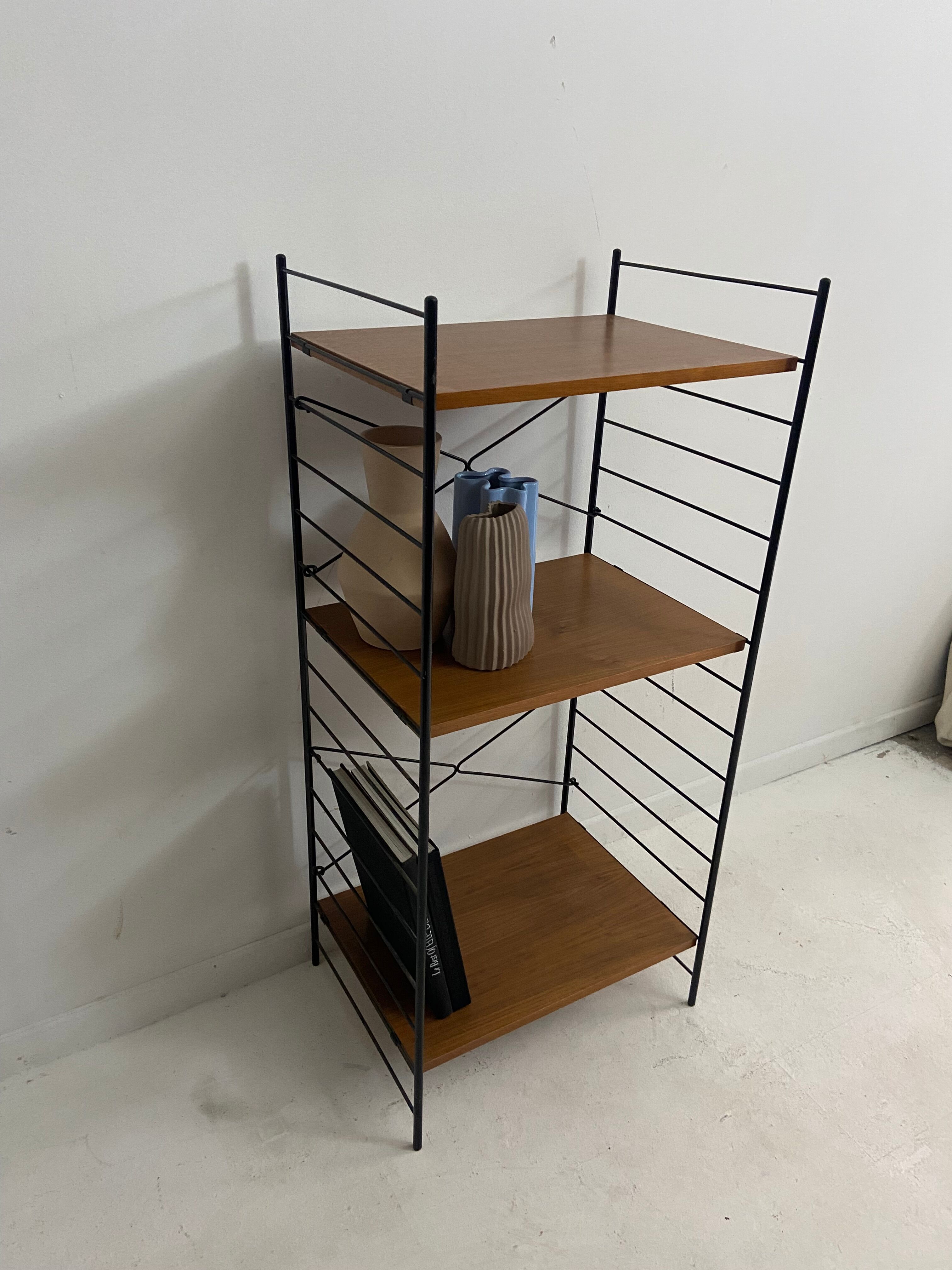 small vintage metal and teak string bookshelf