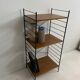 small vintage metal and teak string bookshelf