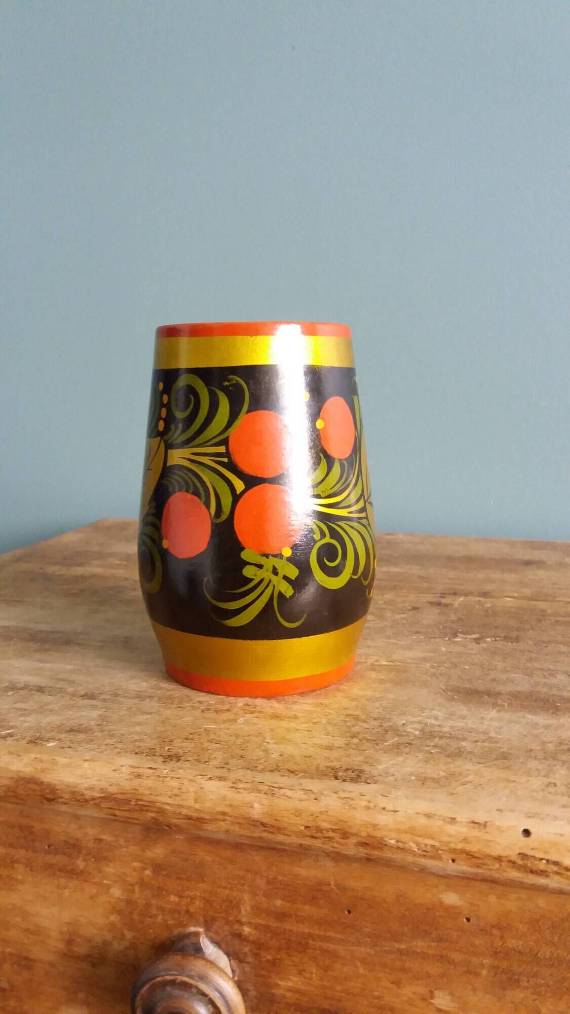 Khokhloma vase, Russian lacquered wood craftsmanship, hand-painted decoration.