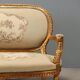 Neoclassical canapé in gilded wood