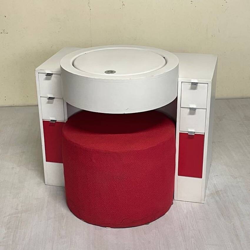 Bathroom toilet with a 70s pouf.