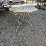 Old garden table in solid wrought iron