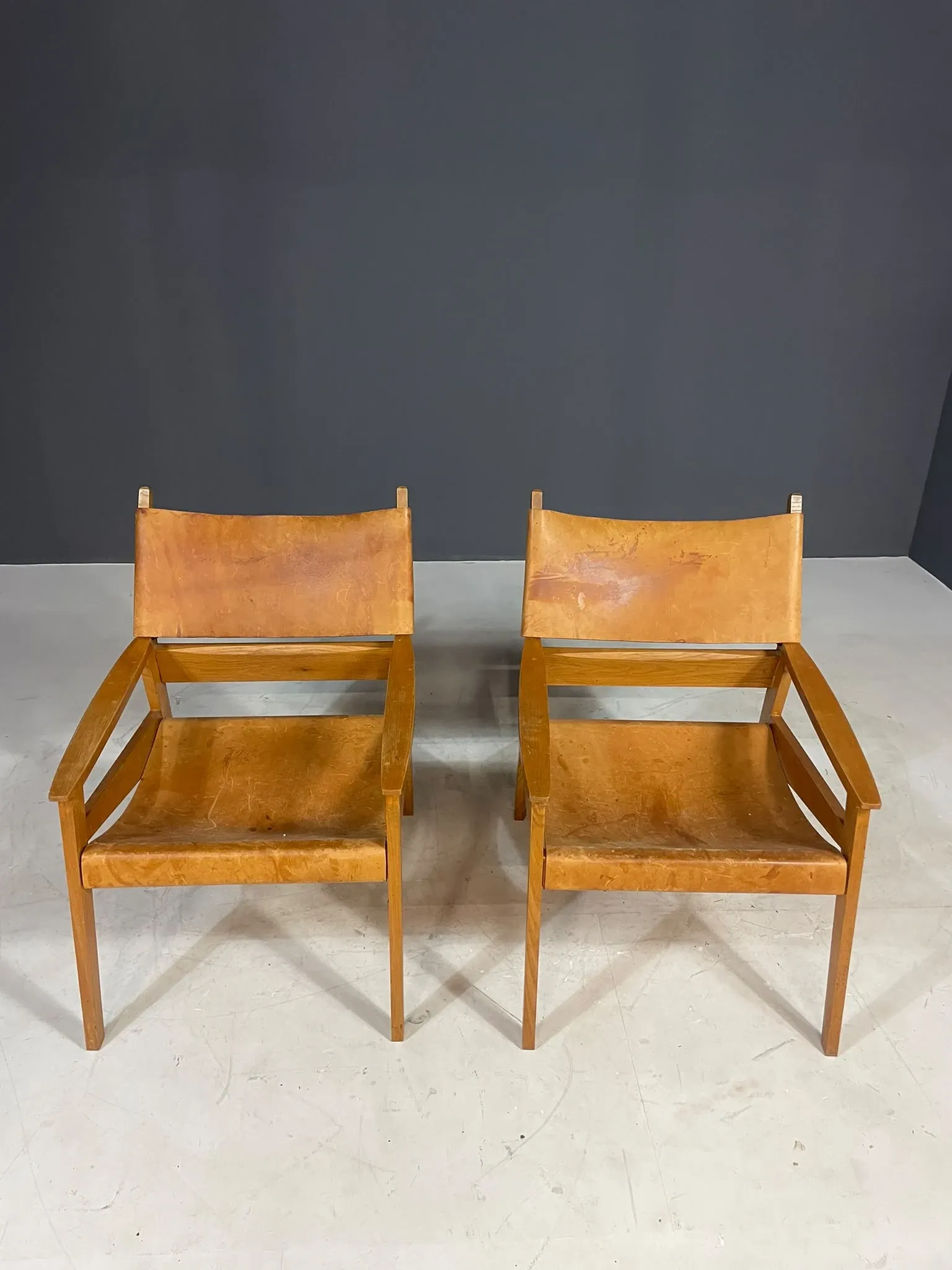 Pair of vintage wooden armchairs with leather upholstery, 20th century, 75 × 56 × 65 cm